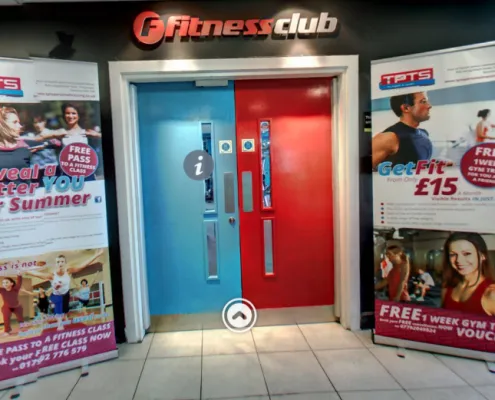 The front doorway and entrance into TPTS Fitness Club Swansea. Board at side stating you can get fit for as little as £15 a month